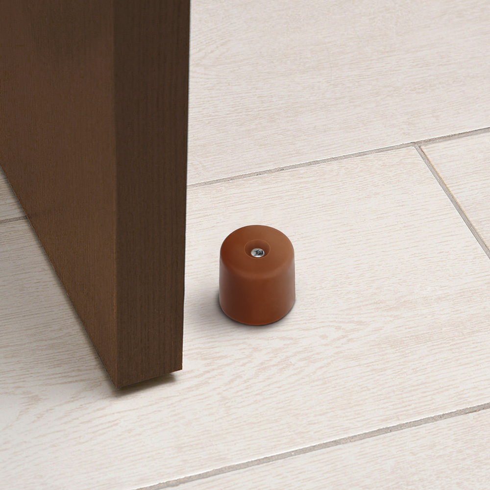 Tope puerta atornillar - Realizado en goma. - Color: Marron - Para su correcta colocaci&oacute;n es necesario el uso de tornillo. como queda